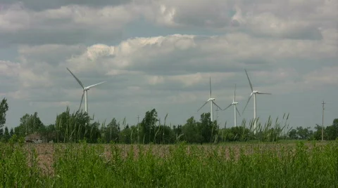 Wind turbines spin amidst a cloudy sunny day (High Definition) Stock Footage 365360