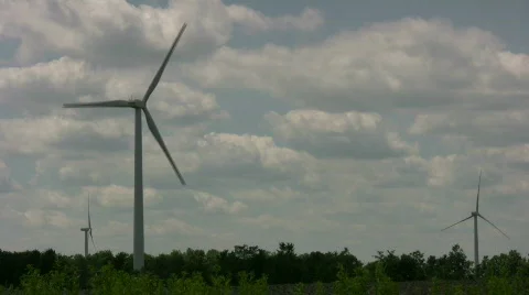 Wind turbines spin amidst a cloudy sunny day (High Definition) Stock Footage 365361