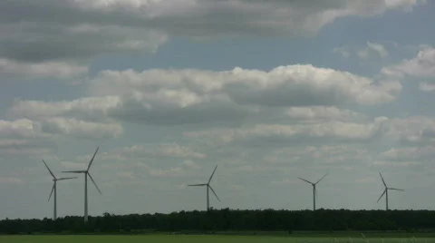 Wind turbines spin amidst a cloudy sunny day (High Definition) Stock Footage 365363