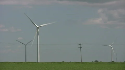 Wind turbines spin amidst a cloudy sunny day (High Definition) Stock Footage 365364