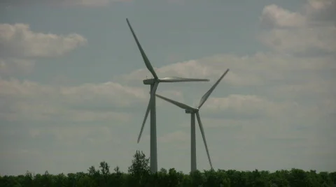 Wind turbines spin amidst a cloudy sunny day (High Definition) Stock Footage 365407