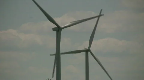 Wind turbines spin amidst a cloudy sunny day (High Definition) Stock Footage 365408