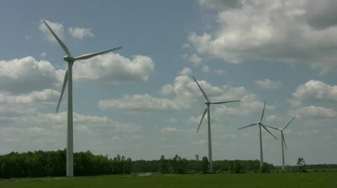 Wind turbines spin amidst a cloudy sunny day (High Definition) Stock Footage 365409