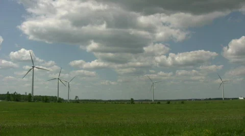 Wind turbines spin amidst a cloudy sunny day (High Definition) Stock Footage 365411