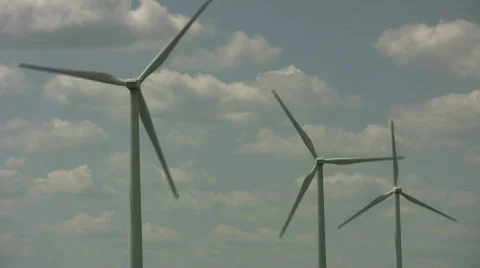 Wind turbines spin amidst a cloudy sunny day (High Definition) Stock Footage 365412