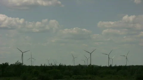 Wind turbines spin amidst a cloudy sunny day (High Definition) Stock Footage 365414