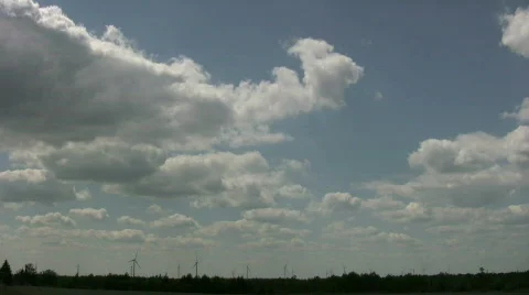 Wind turbines spin amidst a cloudy sunny day (High Definition) Stock Footage 365416