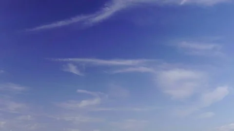 Wind Turbines Spin in Field Behind Farm Stock Footage 75934909