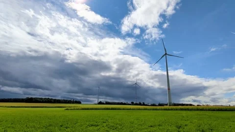 Wind turbines spinning on a cloudy and windy day. Stock Footage 317579939