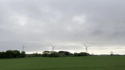 Wind turbines spinning in distant landscape Stock-Footage 335589135