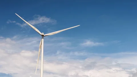 Wind Turbines Spinning Under Clear Blue Sky Stock-Footage 308917043