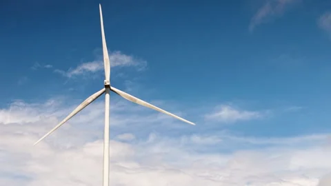 Wind Turbines Spinning Under Clear Blue Sky Video stock 308917184