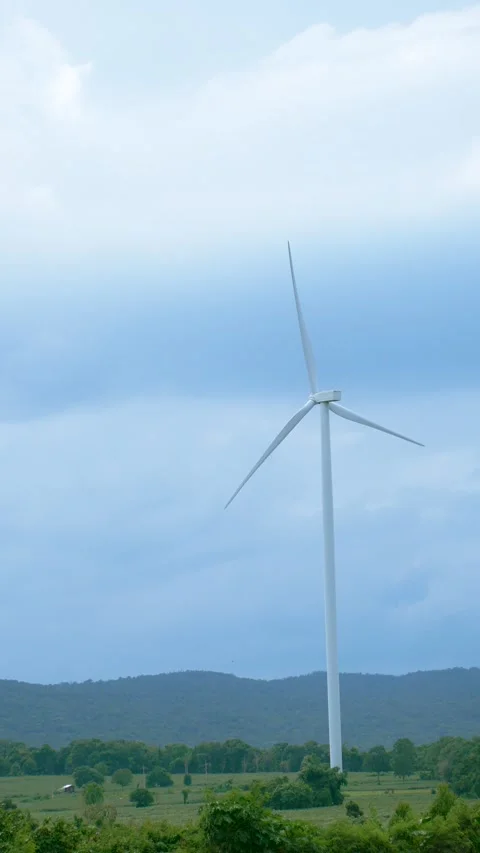 Wind turbines stand tall for generating electricity, sustainable energy solution Stock Footage 281551024