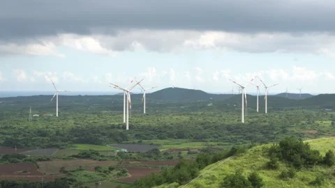 Wind turbines standing in an open field Stock Footage 332769309