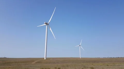 Wind turbines in steppe on background of blue sky Stock Footage 94123181