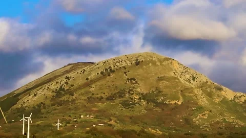 Wind Turbines on a Sunny Day Overlooking the Mountains. Eco Farm. Stock Footage 236935618