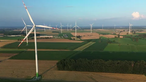 Wind Turbines at Sunset Over Farmland – 4K ProRes Stock-Footage 340258341