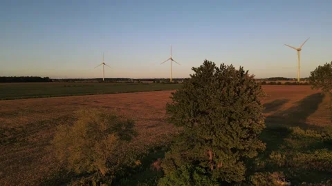 Wind Turbines At Sunset Pan Down Stock Footage 139901612