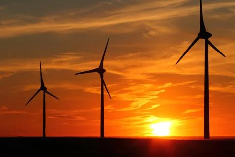 Wind turbines at sunset Stock Photos