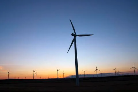 Wind turbines at sunset Stock Photos