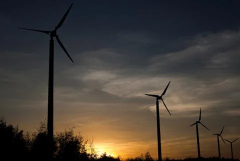 Wind turbines in the sunset Stock Photos