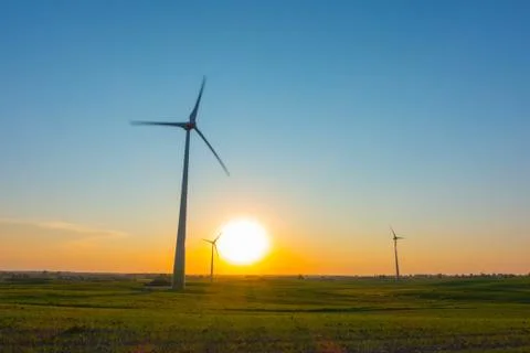 Wind turbines at sunset Stock Photos