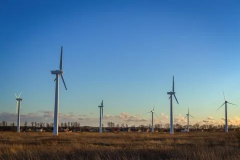 Wind turbines at sunset Stock Photos