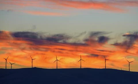 Wind turbines in the sunset Stock Photos