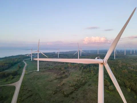 Wind turbines on sunset Stock Photos