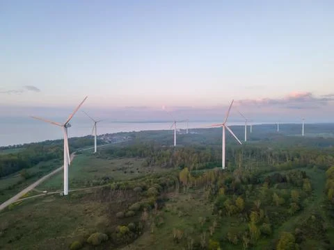 Wind turbines on sunset Stock Photos
