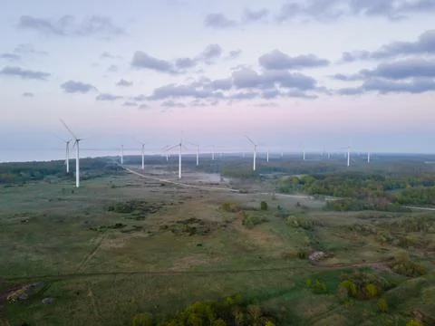 Wind turbines on sunset Stock Photos