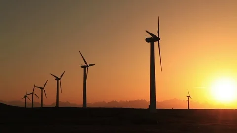 Wind turbines at sunset sky background Vídeo Stock 71757989