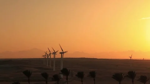 Wind turbines at sunset sky background Stockbeeldmateriaal 72271615