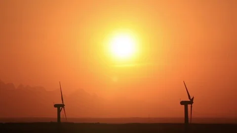 Wind turbines at sunset sky background Stock Footage 75252370
