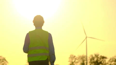 Wind turbines at sunset worker walks at rural substation 스톡 동영상 165195664
