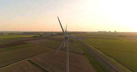 Wind Turbines In Sync, Dutch Highway -  Friesland, The Netherlands – 4K Drone Stock-Footage 123710019