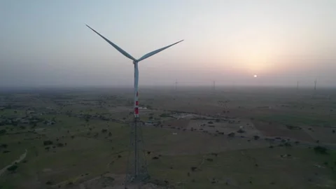 Wind Turbines in the Thar Desert Under Glowing Sunset | 4K Aerial Drone Stock Footage 319834297