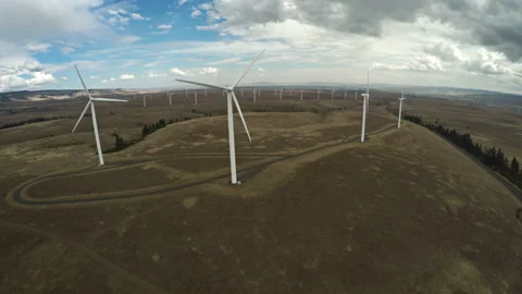 Wind turbines at the top of a hill Stock Footage 154929084
