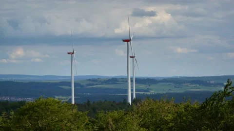 Wind Turbines Towering above a Forest Stock-Footage 133277059