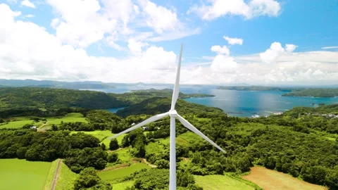 Wind Turbines Turning Under a Blue Sky Stock Footage 335571398