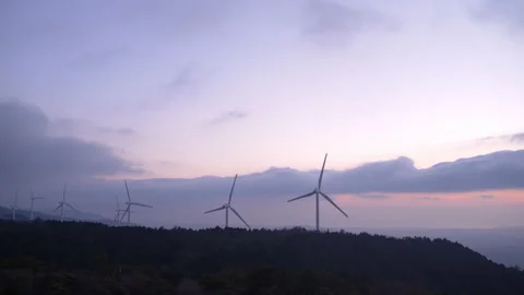 Wind Turbines Turning in the Wind on a Hill at Dawn Stock-Footage 150705643