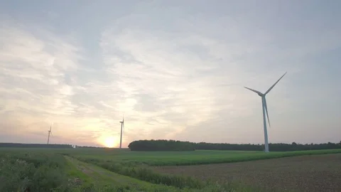 Wind turbines turning in the wind at sunset Video stock 69835221