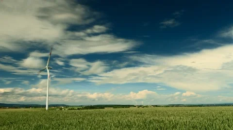 Wind Turbines under a partly cloudy sky Видео 64547706
