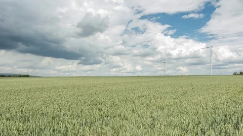 Wind Turbines under a partly cloudy sky Видео 111139500
