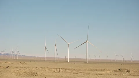 Wind turbines in vast empty desert landscape Stock Footage 326226935