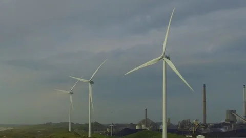 Wind turbines versus coal central at the end of North Sea Canal of Amsterdam Stock Footage 76693031