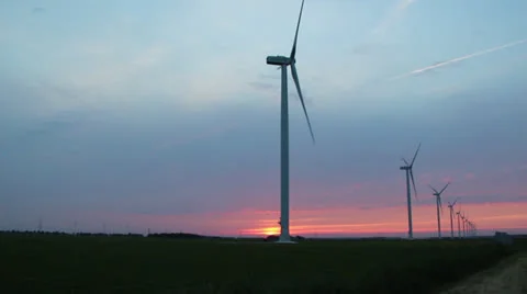 Wind turbines while sun is going down Stock Footage 24868343