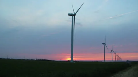 Wind turbines while sun is going down Stock Footage 24868360
