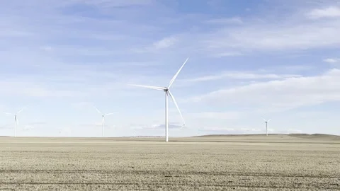 Wind turbines on wide open plain with clear sky. Stock Footage 329315647