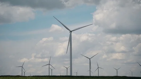 Wind turbines in a wind farm with a dramatic stormy sky in the background 스톡 동영상 112341881